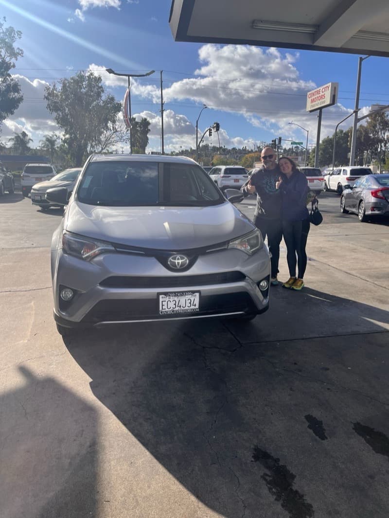 Grant and his wife with their 2018 Toyota RAV4 XLE